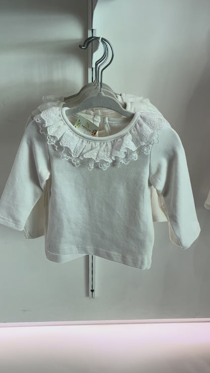 Blusa blanca con solapa